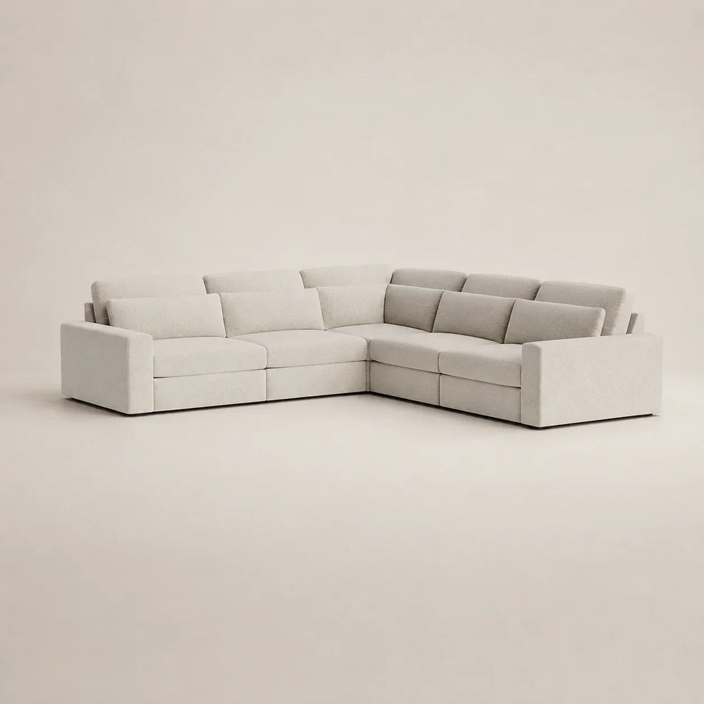 Modern L-shaped sectional sofa in light gray fabric, perfect for luxury living rooms