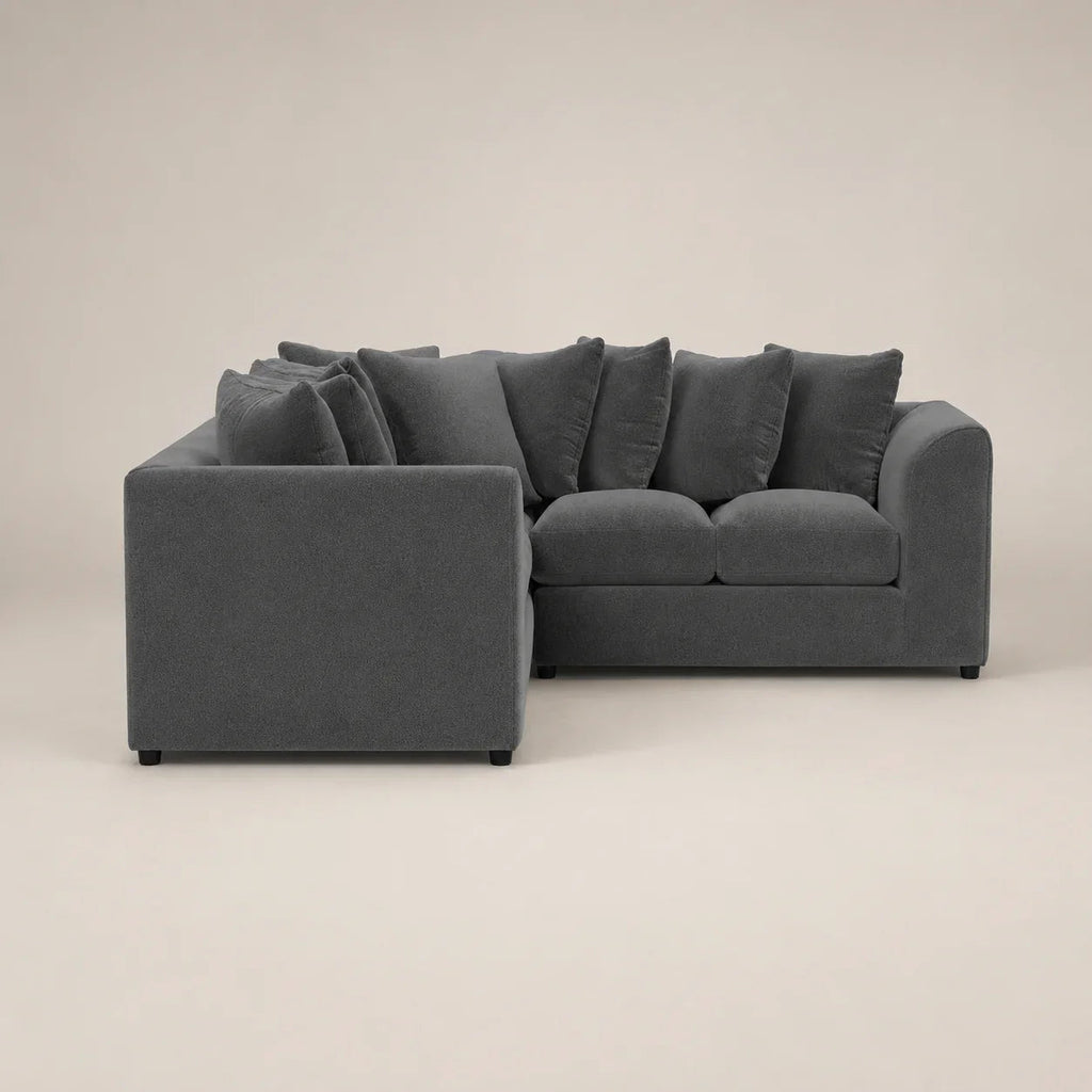 Dark gray sectional sofa with plush cushions, modern design for luxury living spaces