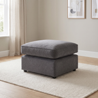Chelton Footstool — lifestyle hero with squared seat cushions