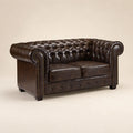 Luxury brown leather Chesterfield sofa with tufted back and rolled arms, ideal for elegant living rooms