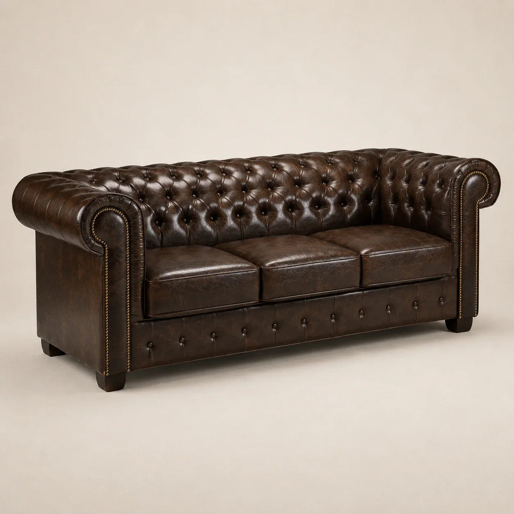 Luxury brown leather Chesterfield sofa with tufted back and rolled arms, perfect for elegant living rooms.