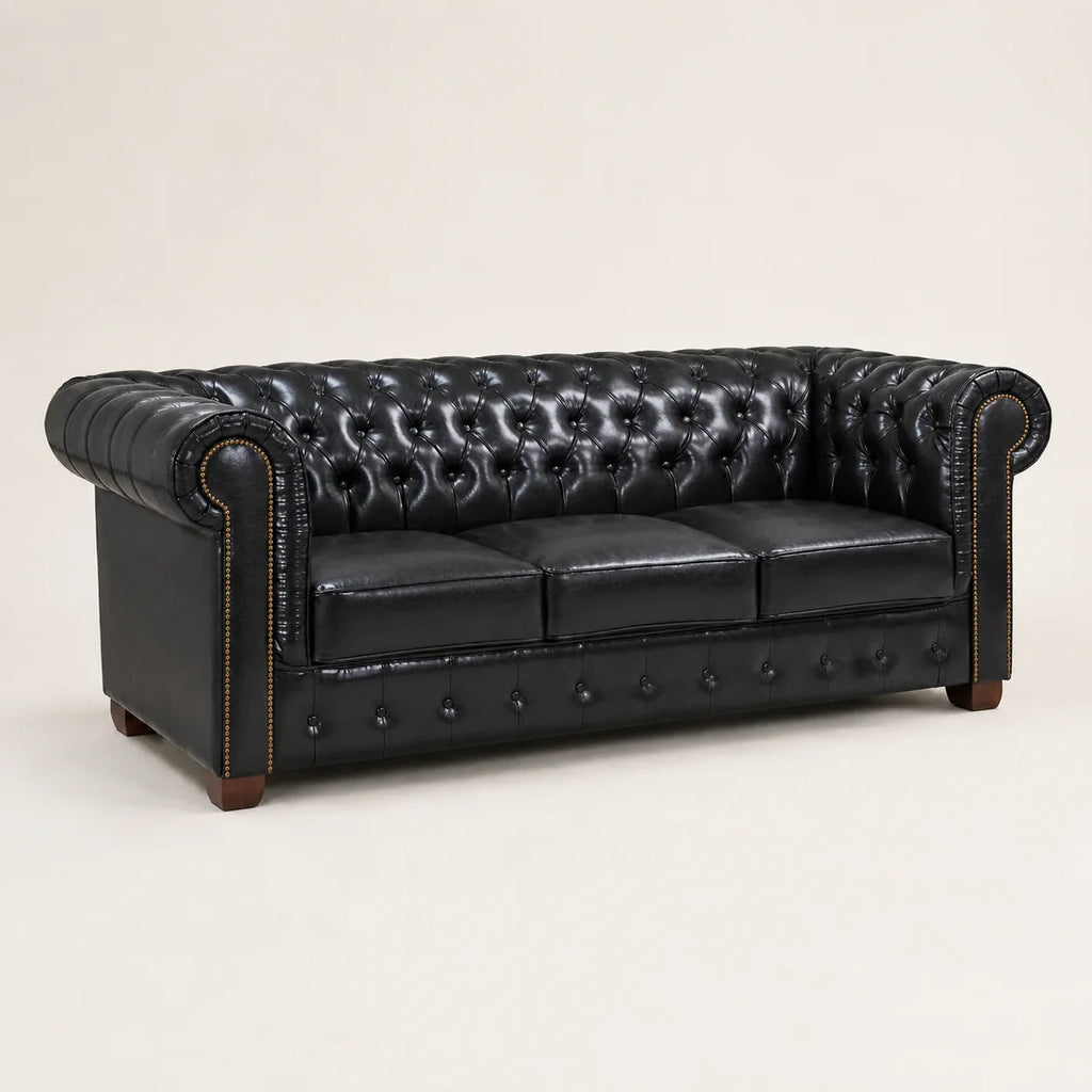 Luxury black leather Chesterfield sofa with tufted back and rolled arms, ideal for elegant living rooms