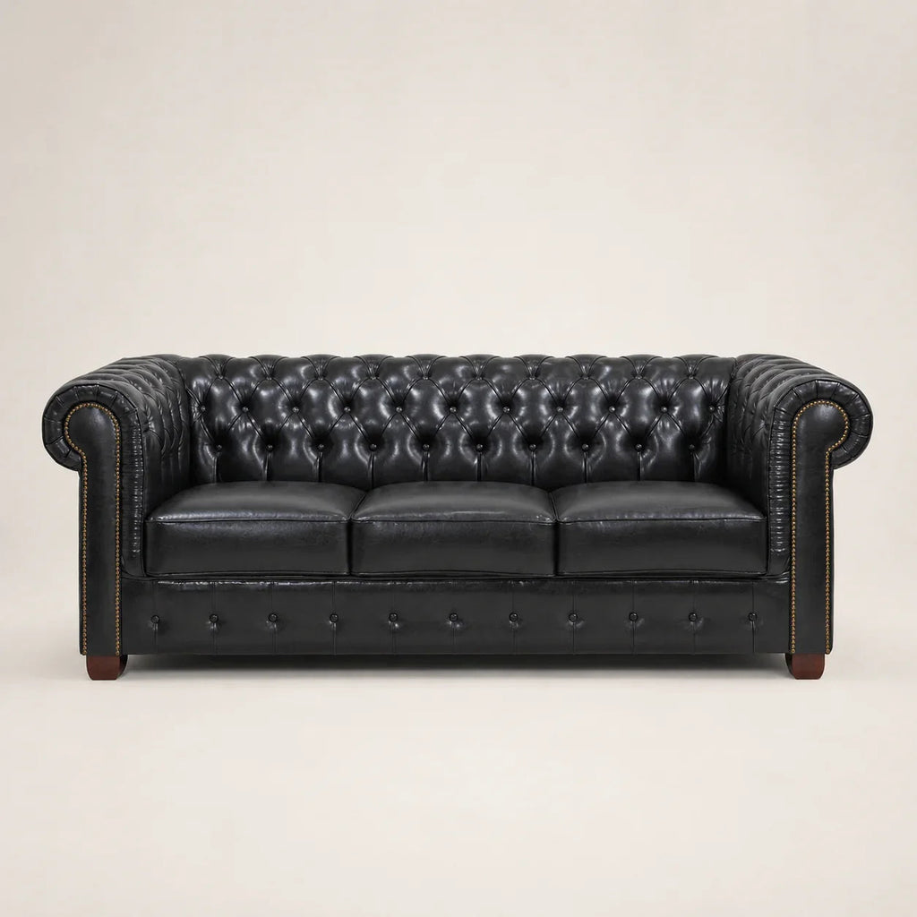 Black leather Chesterfield sofa with tufted back and rolled arms, luxury living room furniture