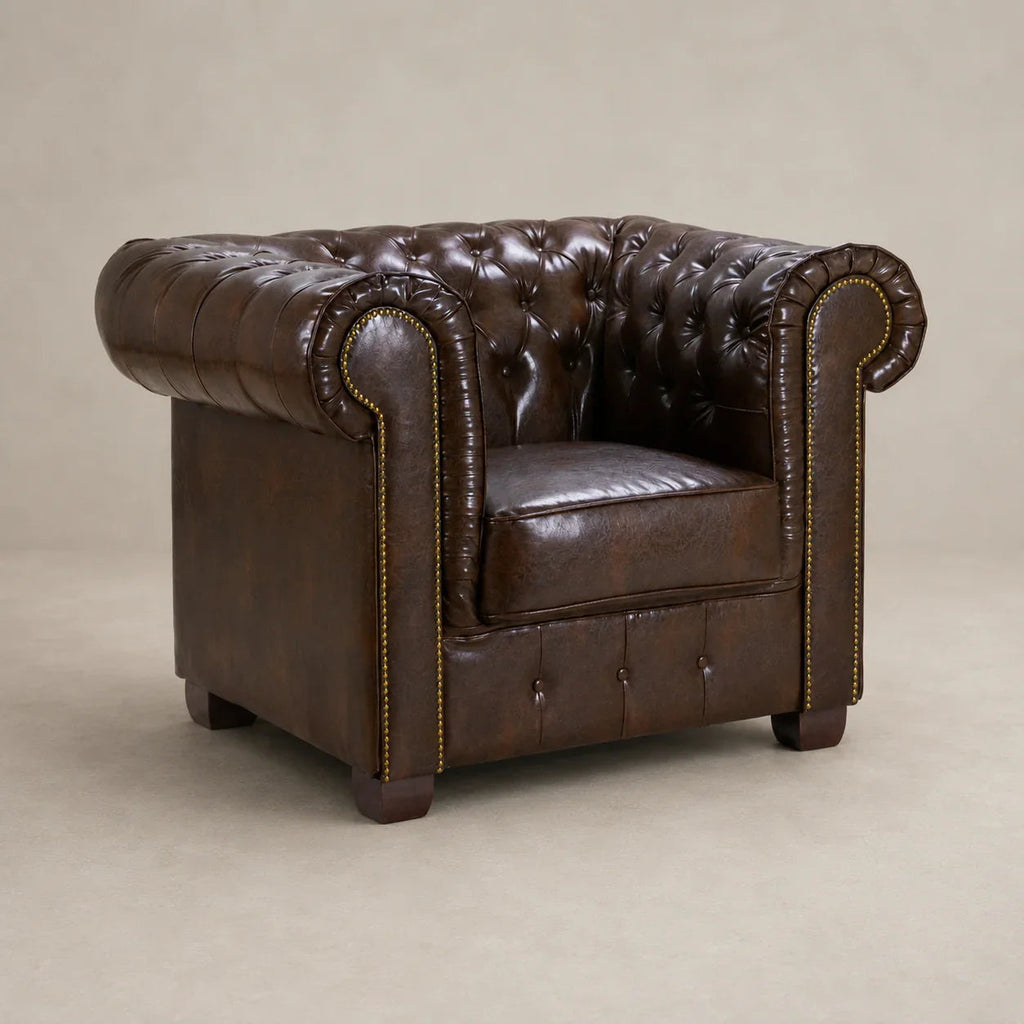 Luxury brown leather Chesterfield armchair with tufted back and rolled arms, ideal for living room comfort.