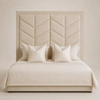 Luxury beige upholstered bed with geometric chevron headboard and matching pillows, perfect for modern bedrooms.