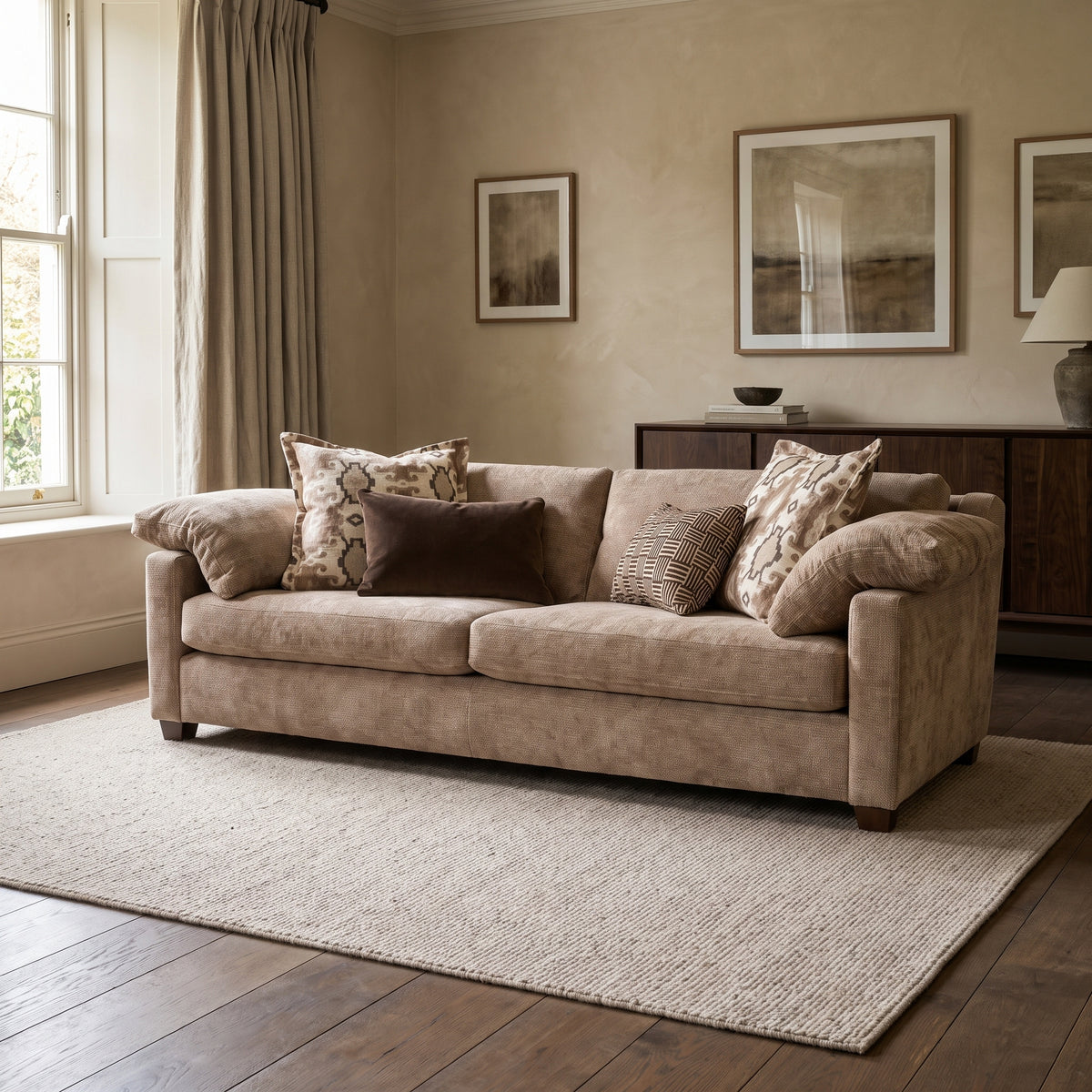 Ashbourne 4 Seater Sofa — main lifestyle view in a warm stone and walnut living room