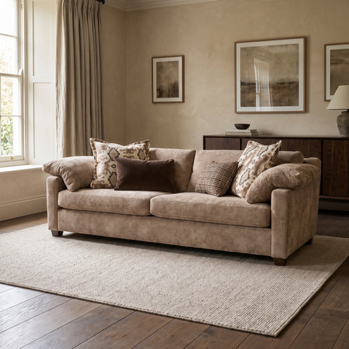 Ashbourne 4 Seater Sofa — main lifestyle view in a warm stone and walnut living room