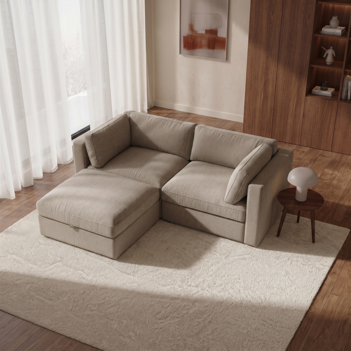 Bellano 2 Seater Sofa + Footstool — elevated camera view in a warm stone and walnut living room
