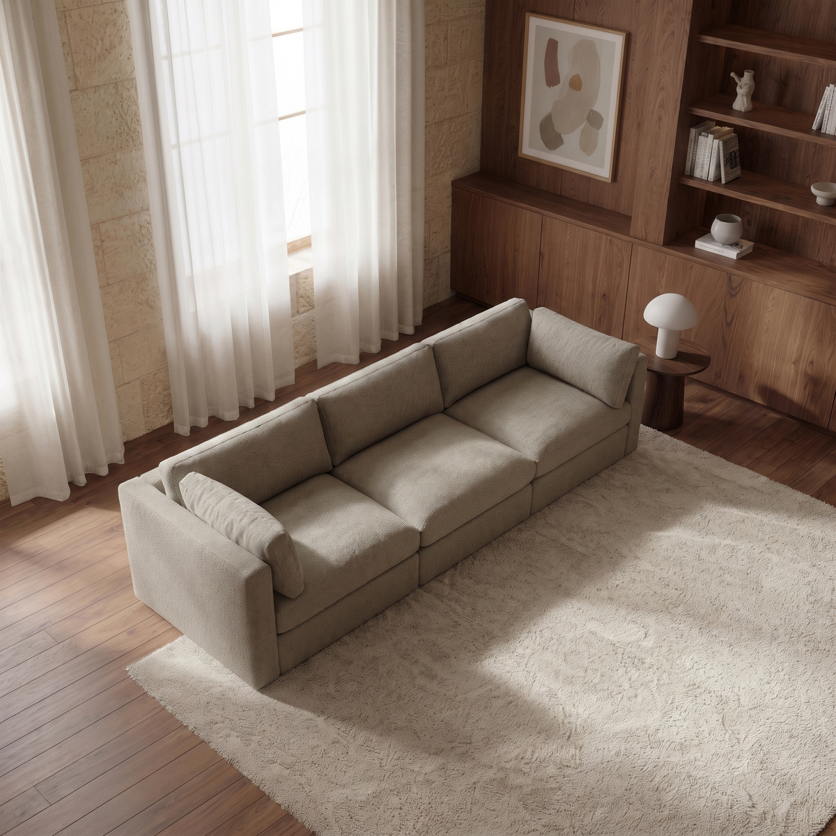 Bellano 3 Seater Sofa — elevated camera view in a warm stone and walnut living room