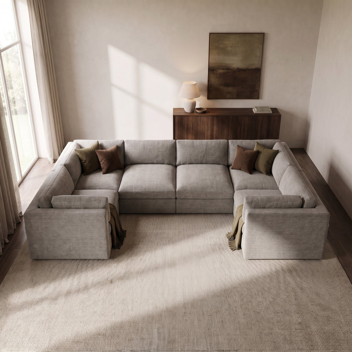 Bellano Grand U-Shape Sofa — elevated camera view in a warm stone and walnut living room