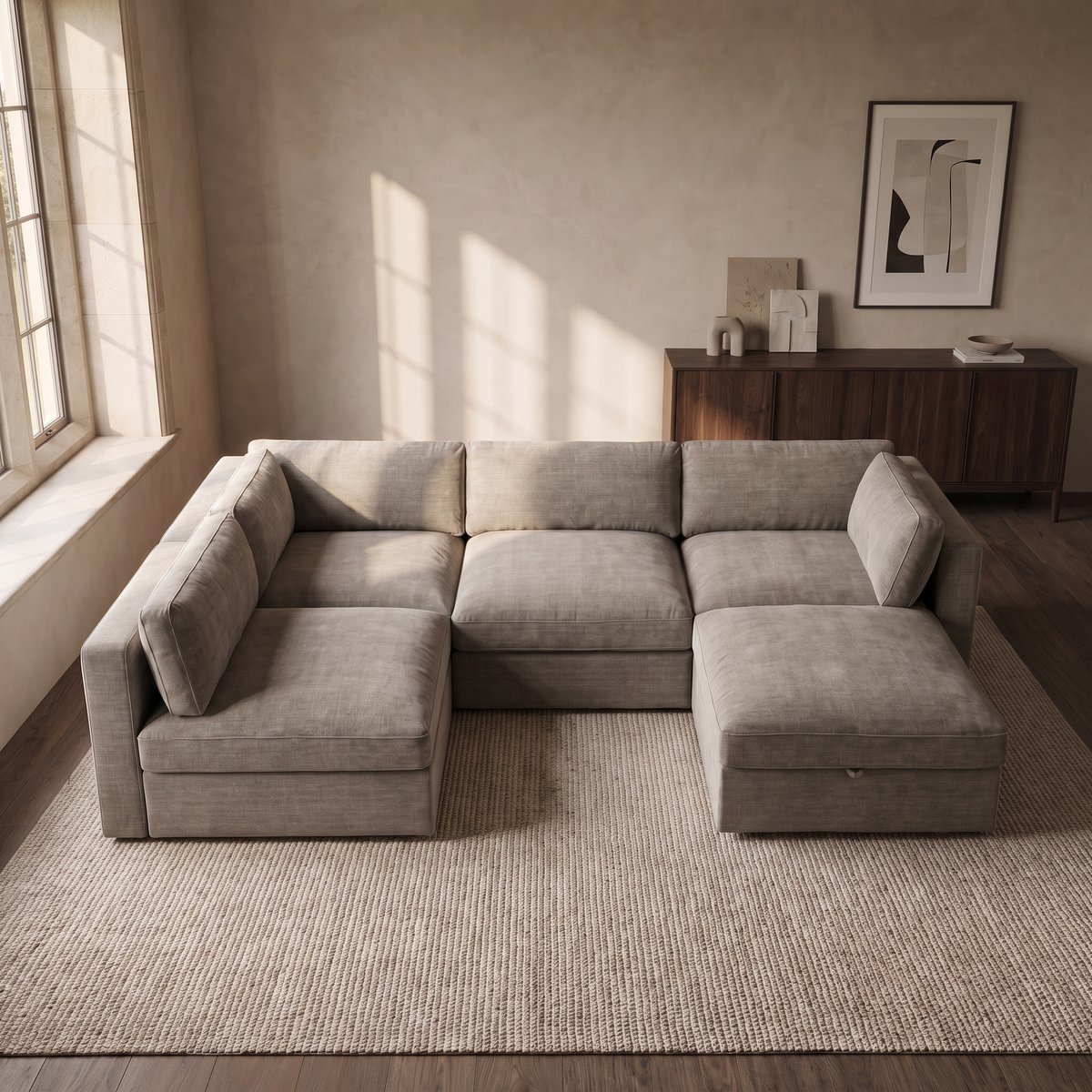 Bellano Large L-Shape Sofa + Storage Ottoman — elevated camera view in a warm stone and walnut living room