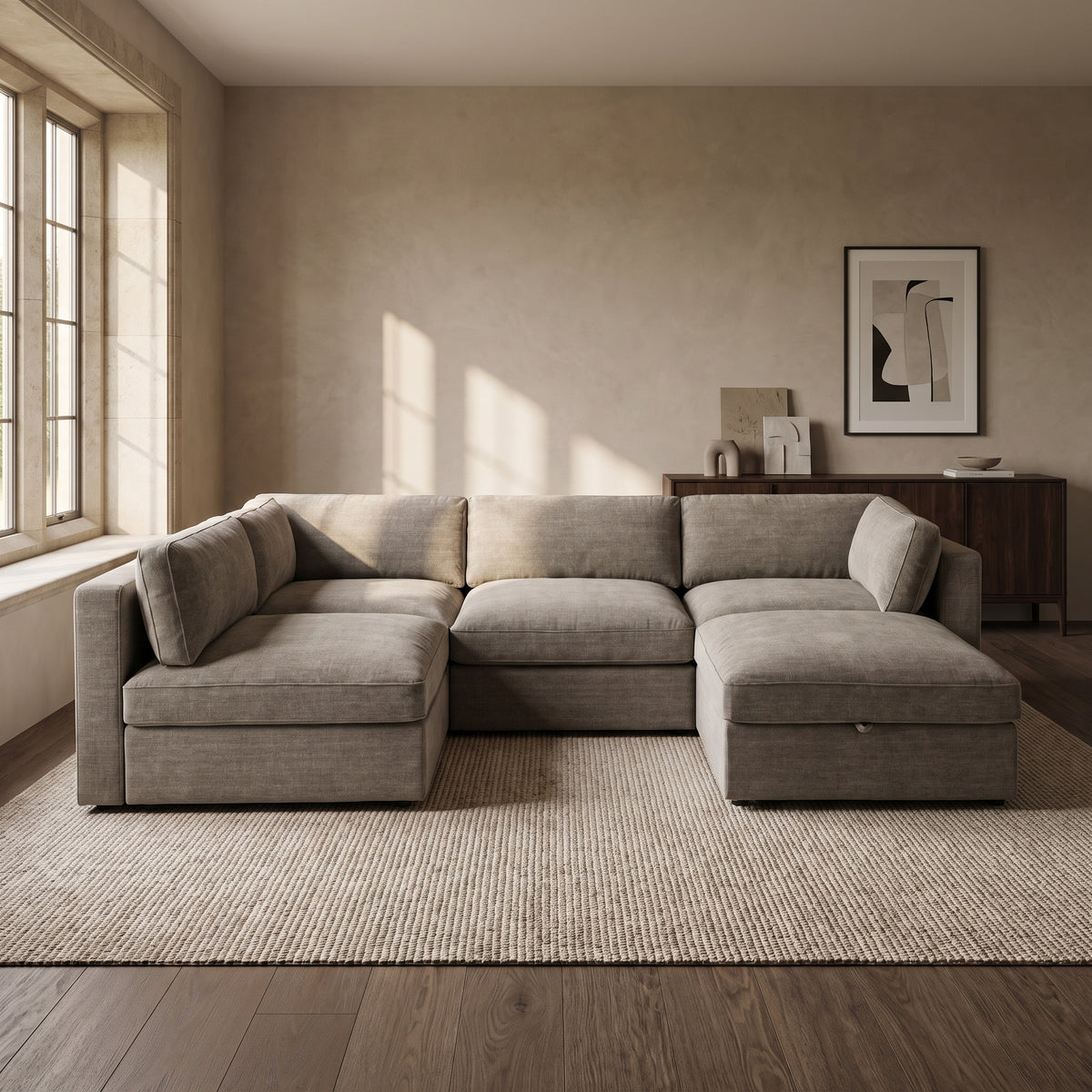 Bellano Large L-Shape Sofa + Storage Ottoman — main lifestyle view in a warm stone and walnut living room