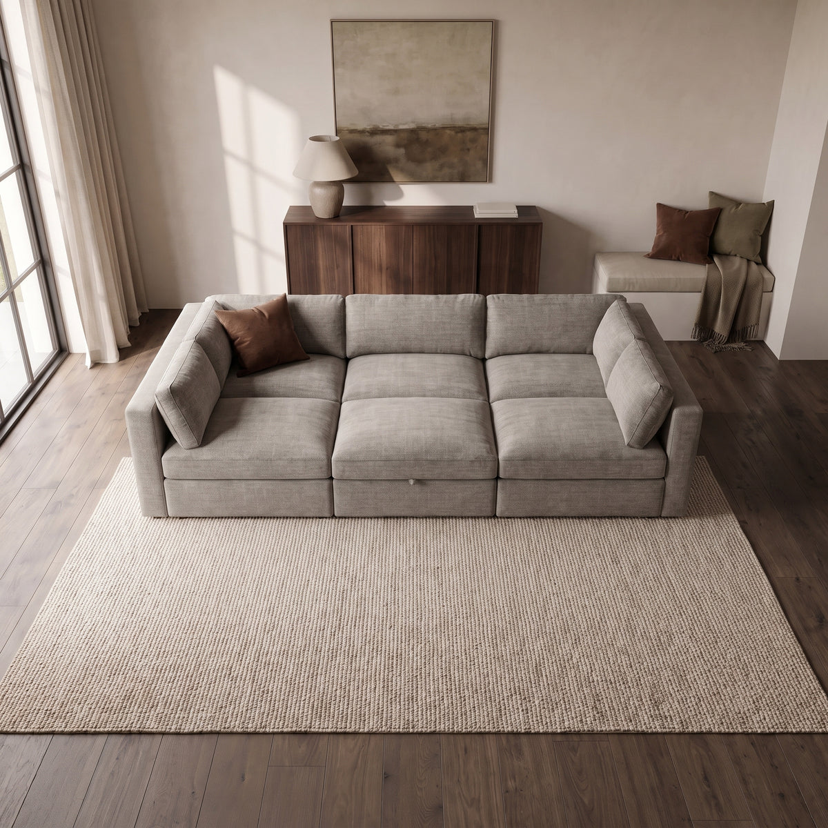 Bellano Pit Cinema Sofa — elevated camera view in a warm stone and walnut living room