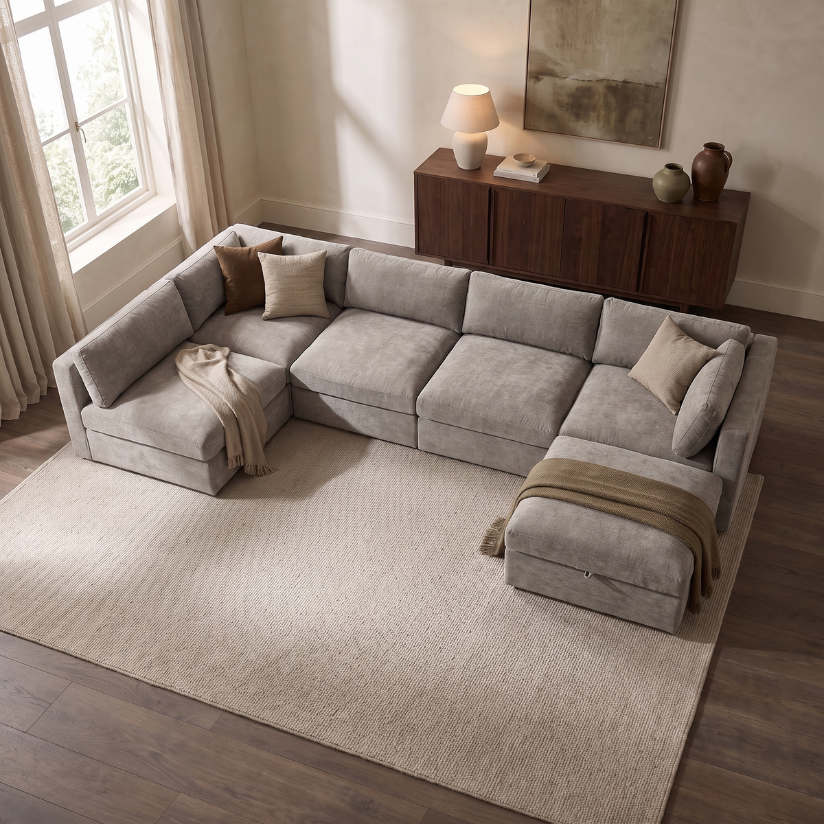 Bellano U-Shape Sofa + Storage Ottoman — elevated camera view in a warm stone and walnut living room