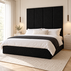 Four Black Teddy 45cm wall panels behind a matching upholstered bed base in a styled bedroom. Room visualisation; panels sold individually, base and styling separate.