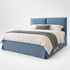 CK Living Eversley upholstered bed in dusty blue linen-look weave — plain cold-white grey background