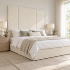 Four Ivory Teddy 45cm wall panels behind a matching upholstered bed base in a styled bedroom. Room visualisation; panels sold individually, base and styling separate.