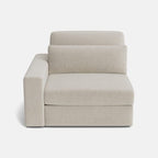 Modern beige modular corner sofa with plush cushions, single armrest, minimalist design
