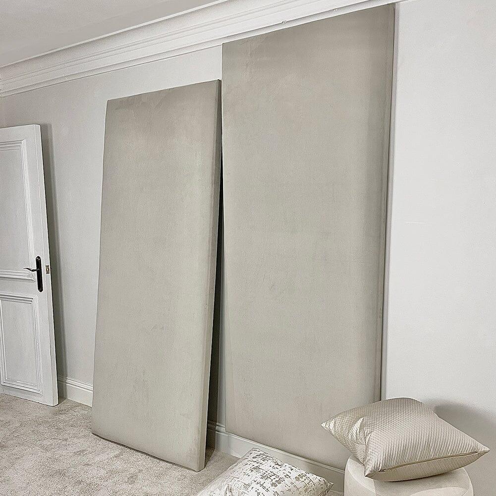 Cream velvet upholstered headboard wall panels in modern bedroom setting