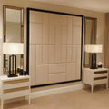 Wall-mounted upholstered headboard in modern bedroom with bedside tables and lamps