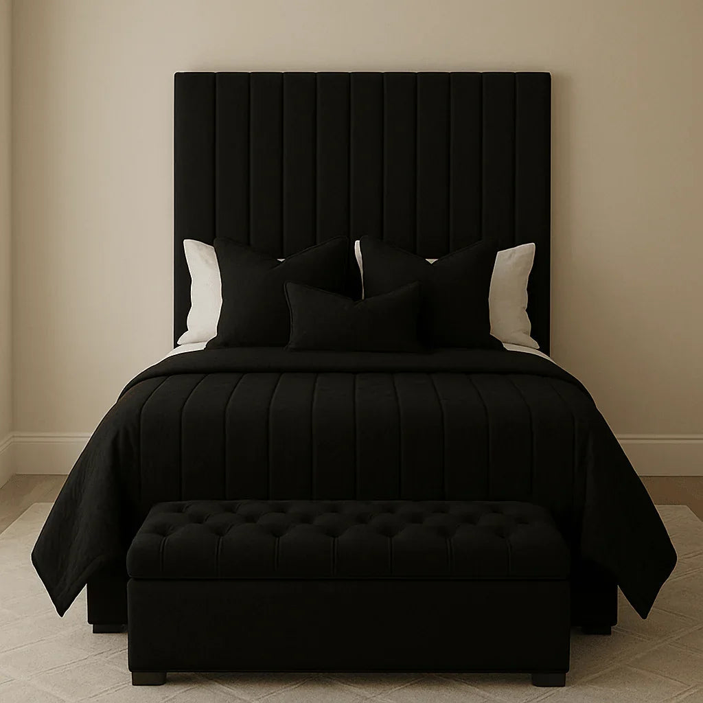 Luxury black velvet bed with tufted headboard and matching bench, styled with black and white bedding