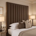 Double bed with bronze premium channelled headboard, neutral bedding, and bedside lamps