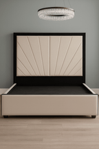 Modern double bed with sunburst panel headboard in beige and black, wood floor, chandelier above