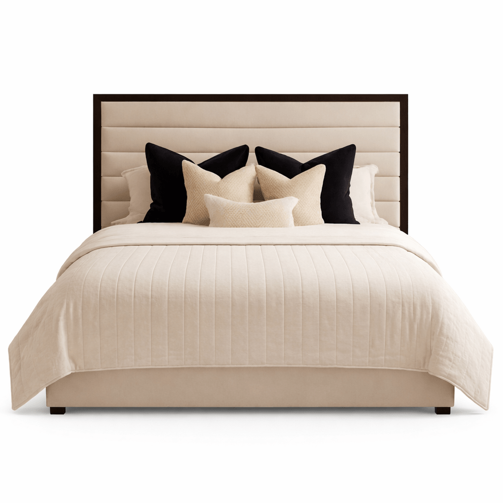 Modern panelled bed with cream upholstery, dark trim headboard, and decorative pillows