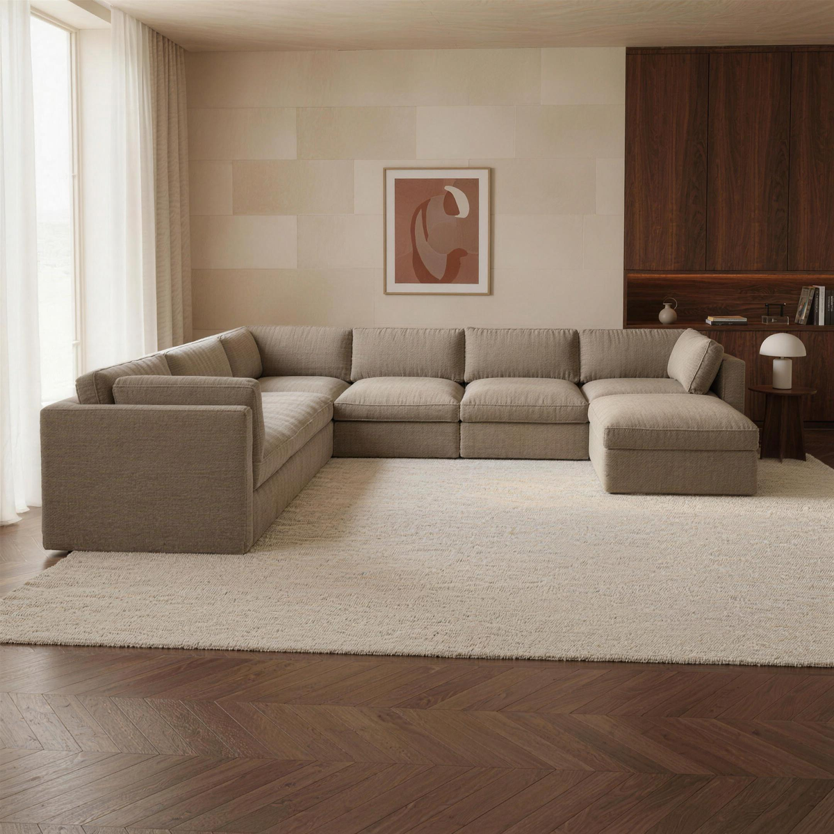 Bellano Grand Corner Sofa + Storage Ottoman in taupe chenille in a warm walnut and limestone living room