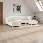 Modern U-shape corner sofa in cream upholstery in a bright living room with wood floors