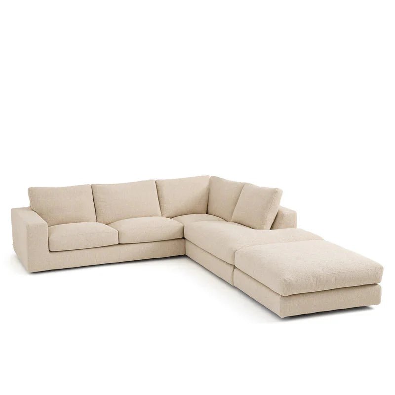 Right hand facing corner sofa in plush cream fabric with deep seats and modern design