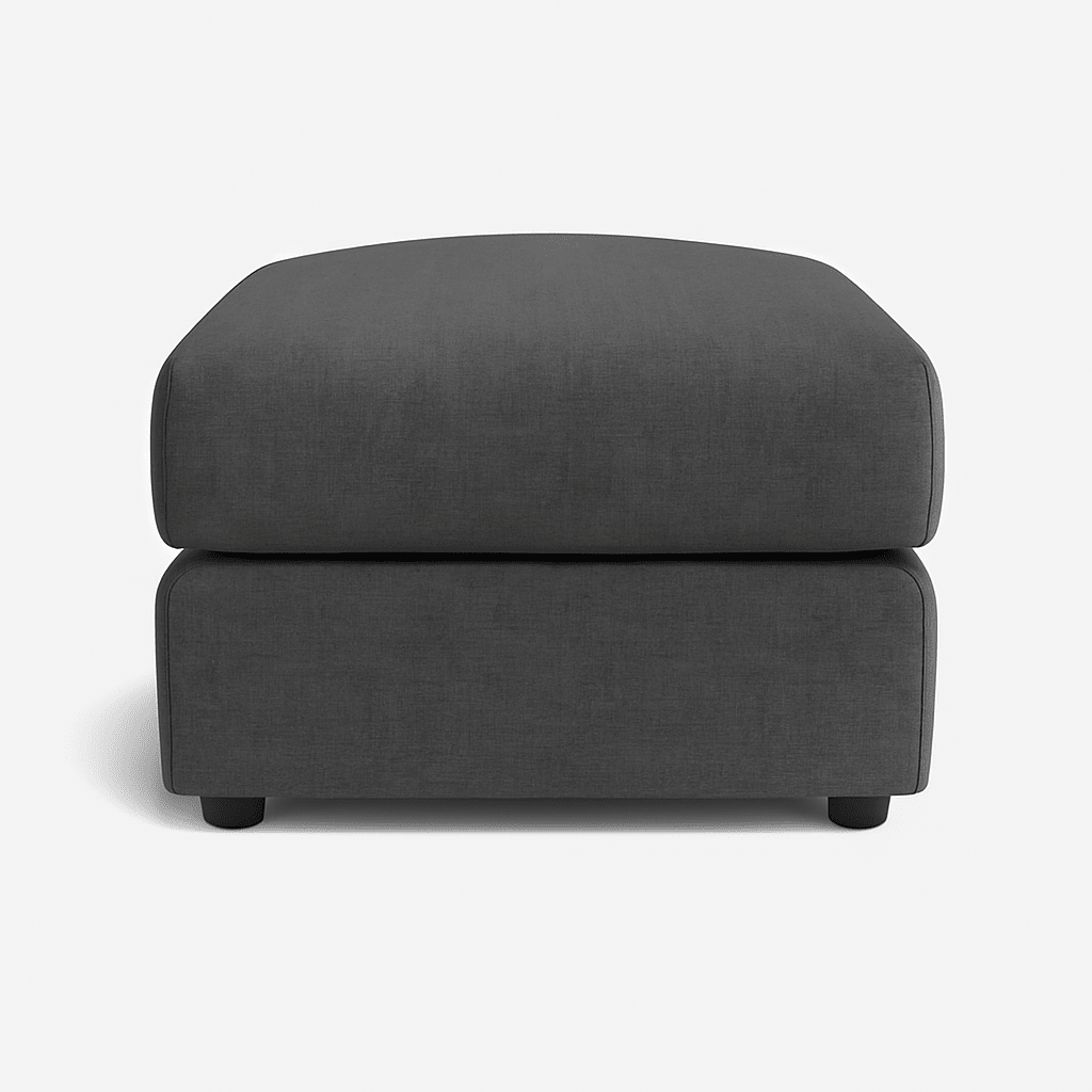 Modern rectangular dark grey fabric ottoman footstool on a white background