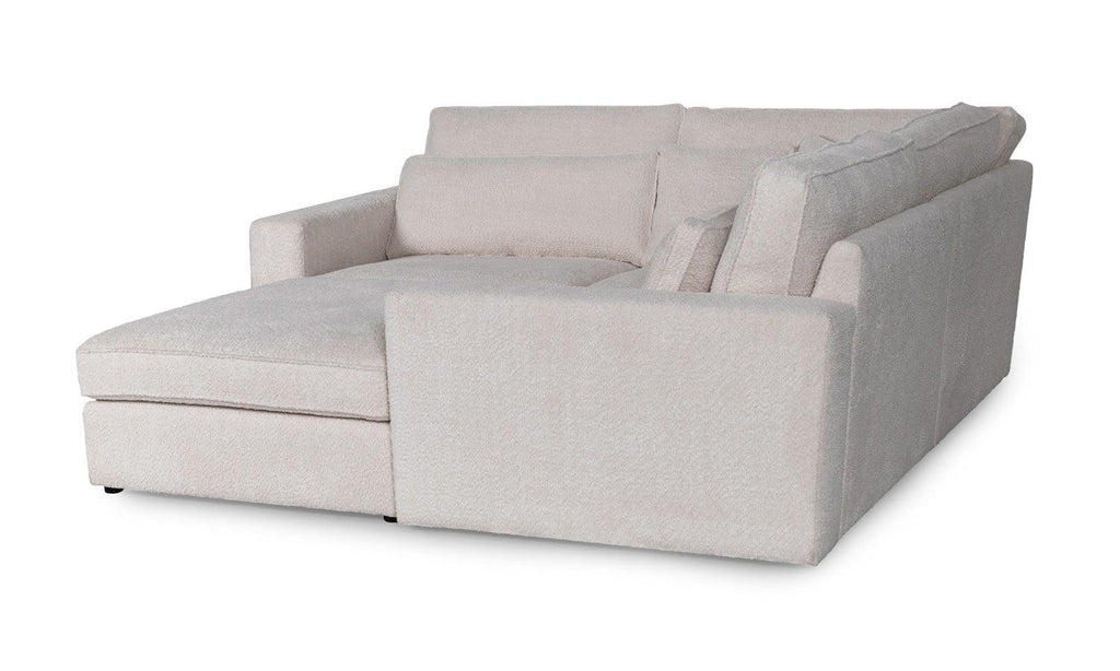 Modern cream boucle corner sofa with wide chaise and plush cushions on white background
