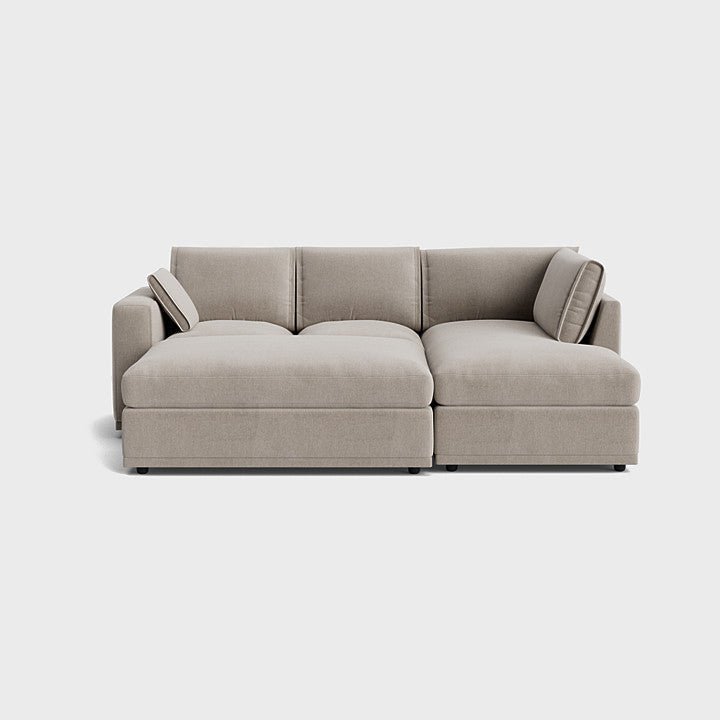 Modern cream right corner sofa with plush cushions on neutral background