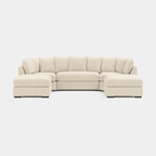 U-shaped beige corner sofa with plush cushions, modern sectional seating, neutral background