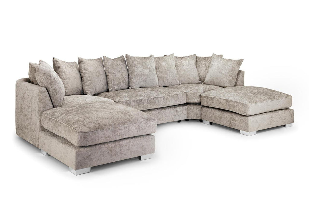 Large U-shaped corner sofa with plush grey upholstery and multiple matching cushions
