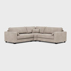 Modern beige corner sofa with plush cushions on a white background
