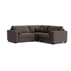 Modern dark grey corner sofa with plush cushions and low arms on a white background