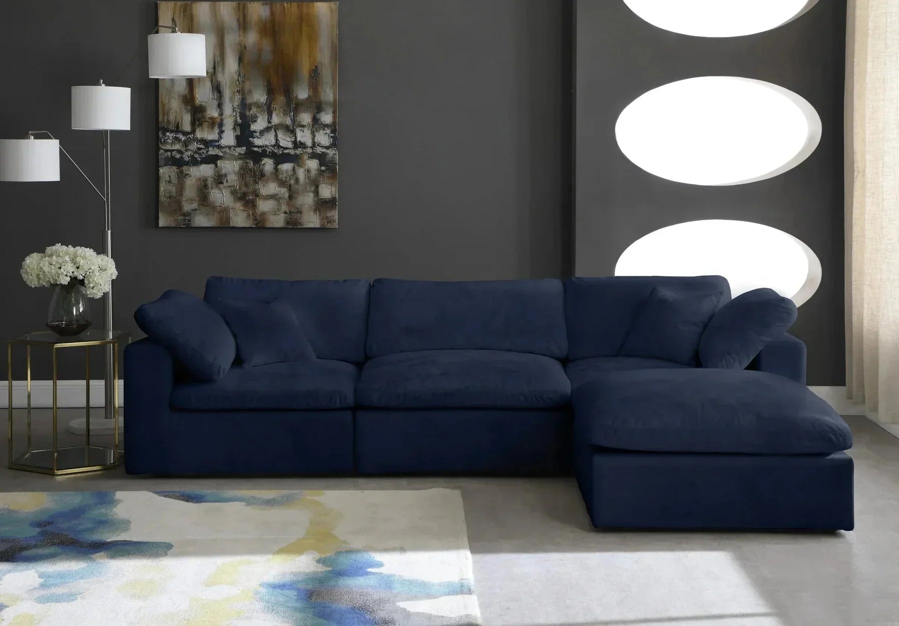 Modern navy blue corner sectional sofa with chaise in stylish living room setting