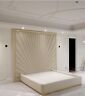 Luxury cream upholstered bed with gold outline deluxe headboard in modern bedroom