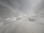 Close-up of a plush, tufted white mattress surface with soft fabric texture