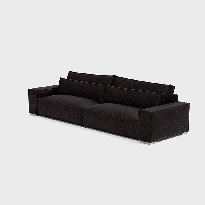 Modern black three-seater sofa with wide arms and plush cushioning on light background