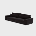 Modern black three-seater sofa with wide arms and plush cushioning on light background