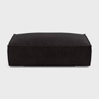 Modern dark fabric rectangular footstool on a plain background, perfect for living rooms.