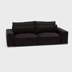 Modern dark grey three-seater sofa with wide arms and plush back cushions on white background