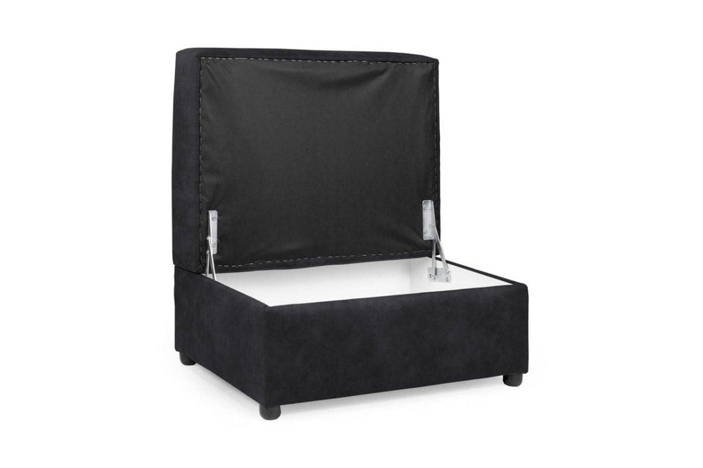 Black velvet storage footstool with open hinged lid on white background