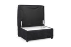 Black velvet storage footstool with open hinged lid on white background