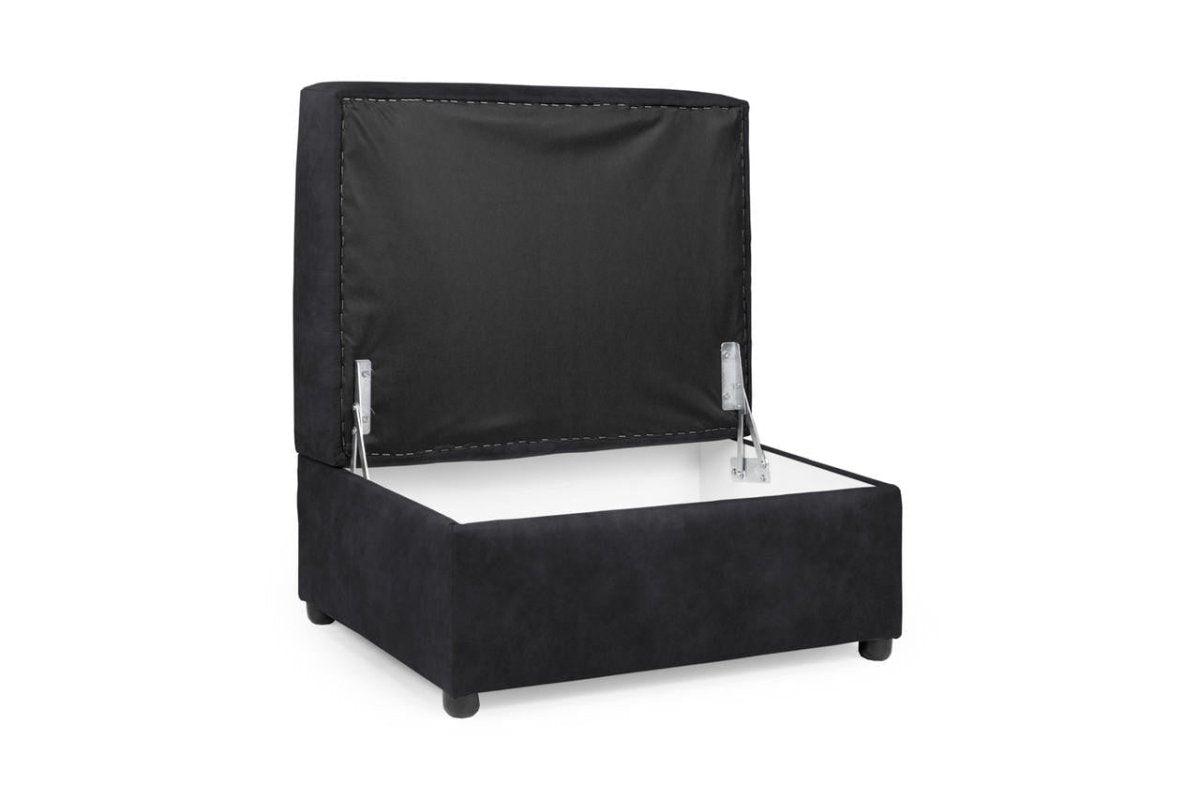 Black velvet storage footstool with open hinged lid on white background