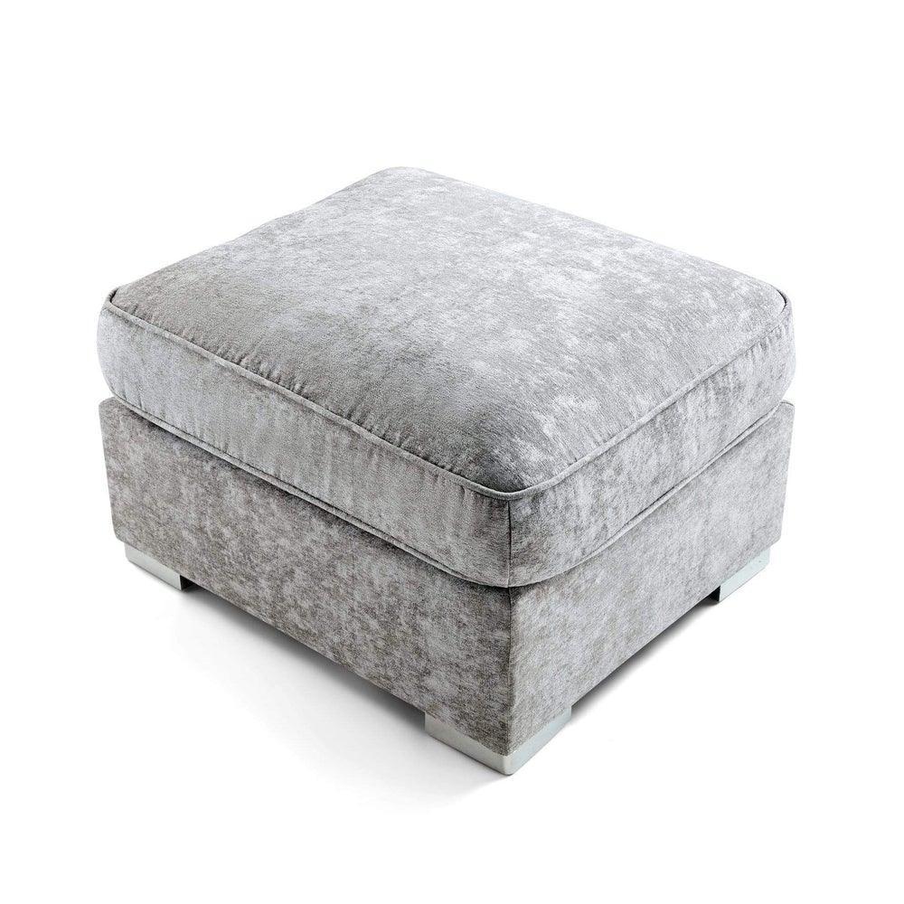 Cream upholstered square footstool with plush cushion and modern low feet on white background