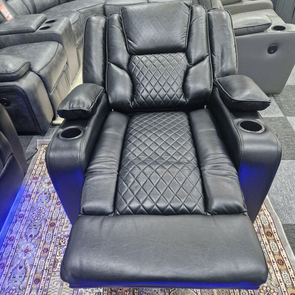 Black leather electric recliner chair with diamond stitching, cup holders, and footrest